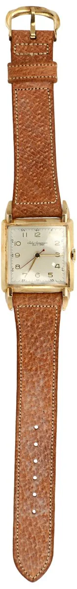 A vintage leather-strapped watch with a rectangular gold-tone case and a white dial, marked with square indices and thin black hands.