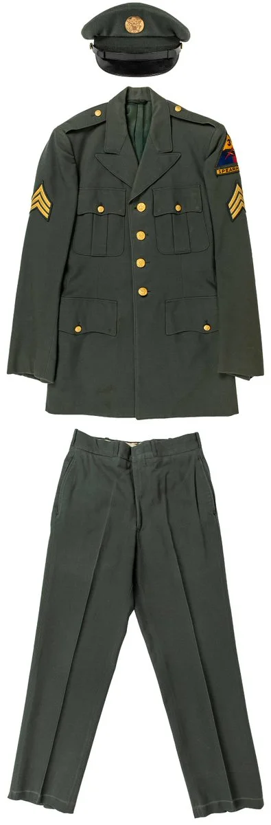 A green United States Army military uniform displayed, consisting of a jacket with gold buttons and insignia on the sleeves, matching trousers, and a cap.