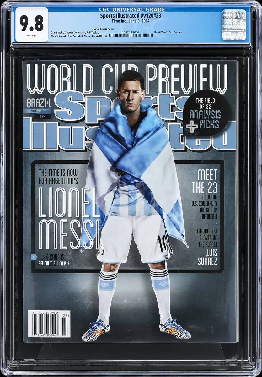 This is a Sports Illustrated magazine cover with a soccer player draped in an Argentinian flag and holding a soccer ball. The text reads "World Cup Preview" and prominently features the name Lionel Messi, along with highlights like "The Time is Now for Argentina" and "Meet the 23". The magazine is encased with a CGC Universal Grade rating of 9.8.