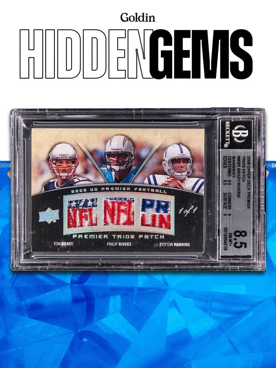 The image shows a sports trading card featuring three football players from the NFL: Tom Brady, Philip Rivers, and Peyton Manning. The card is encased in a protective holder with a grading label showing a score of 8.5. The background is a blue geometric pattern, and at the top, the text reads "Goldin Hidden Gems.