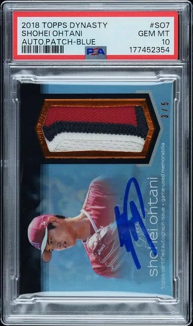 2018 Topps Dynasty Shohei Ohtani baseball card, labeled as Gem Mint, with a multicolored fabric patch and an autograph. Serial number 3/5 is visible. Encased in a protective plastic casing.