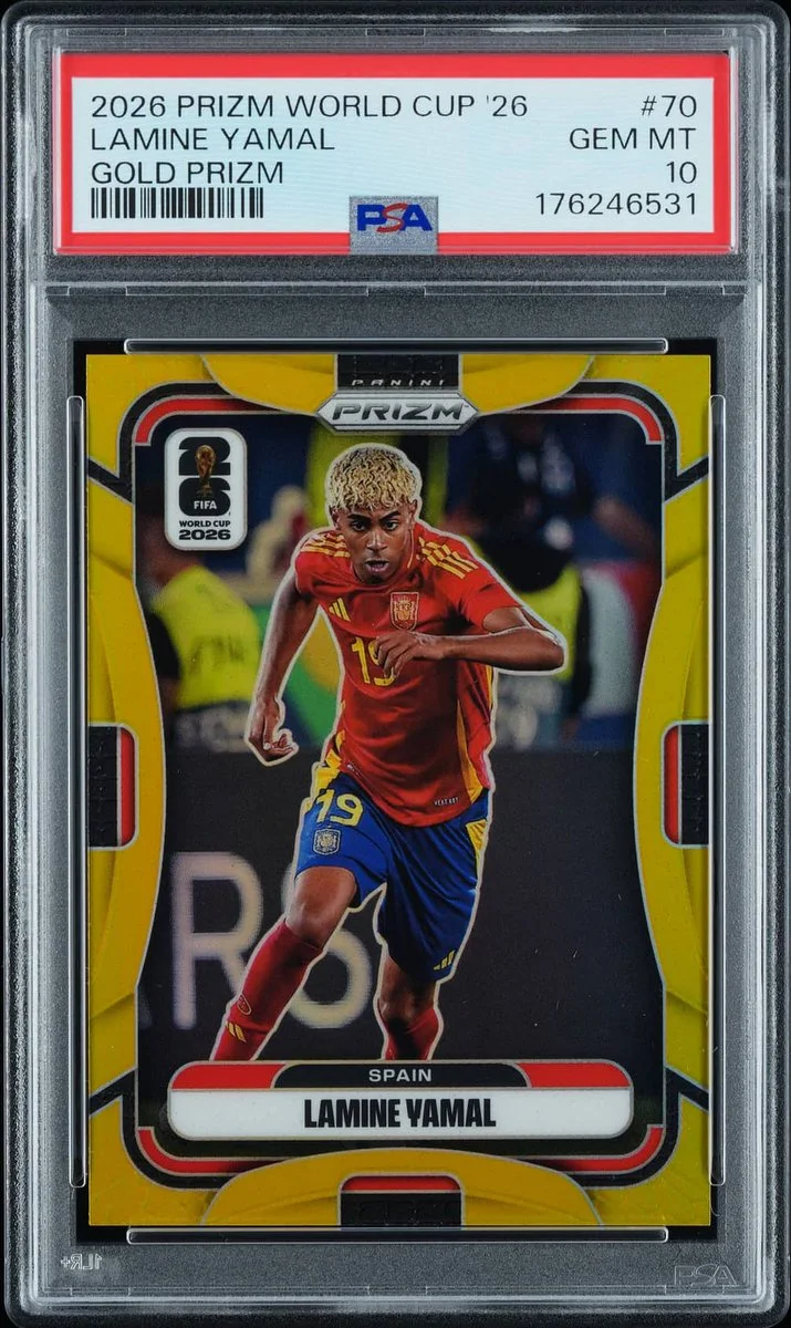 A soccer trading card labeled "2026 Prizm World Cup '26" features a player wearing a red and yellow uniform, numbered 19, with "Spain" noted. The card is graded "PSA 10 GEM MT" and identified as "Lamine Yamal Gold Prizm.