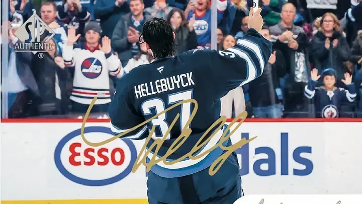 Connor Hellebuyck featured on Authentic Moments Autographs card from Upper Deck's SP Authentic.