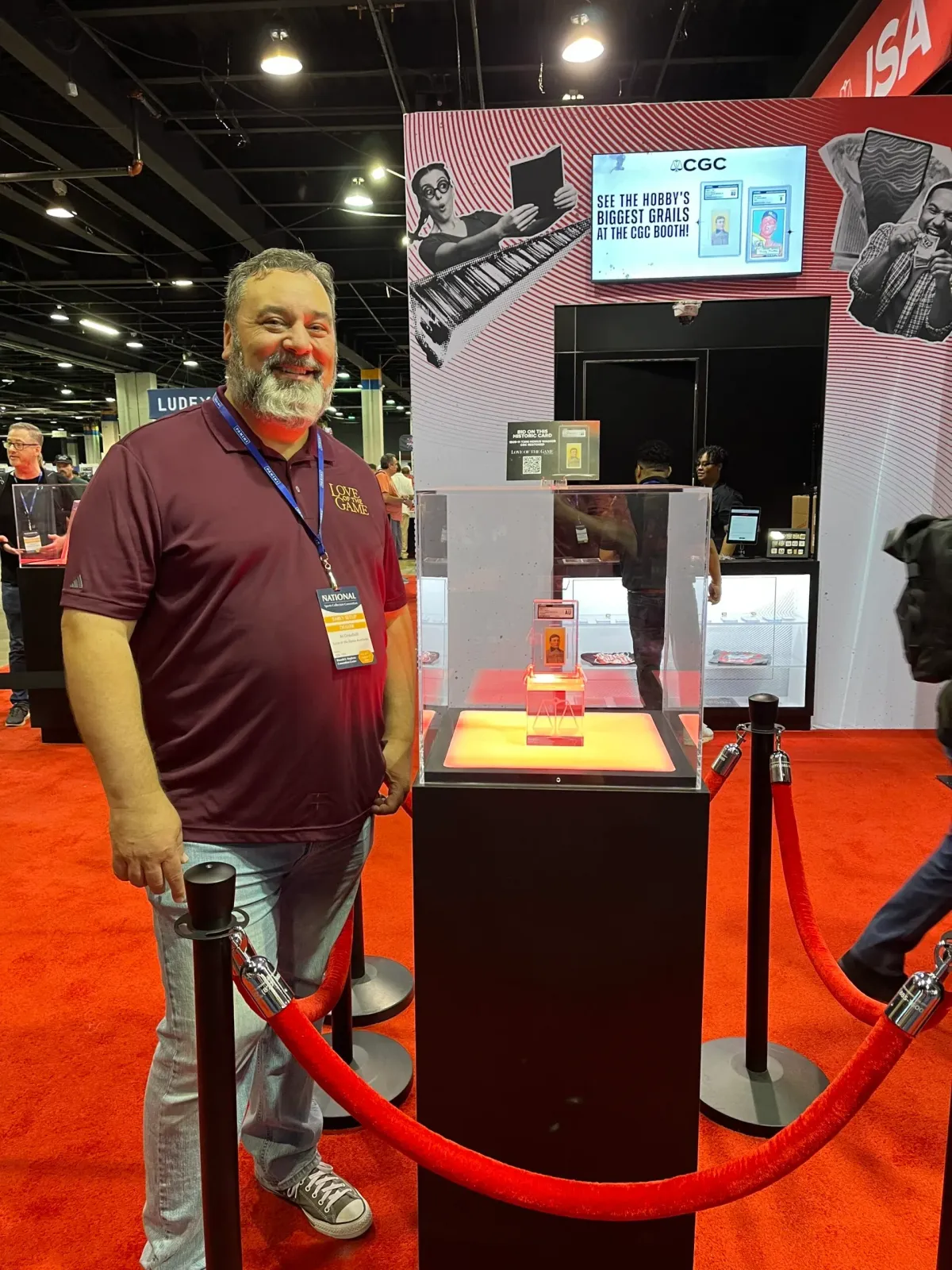Love of the Game Auctions founder Al Crisafulli poses with the T206 Restored Honus Wagner card.