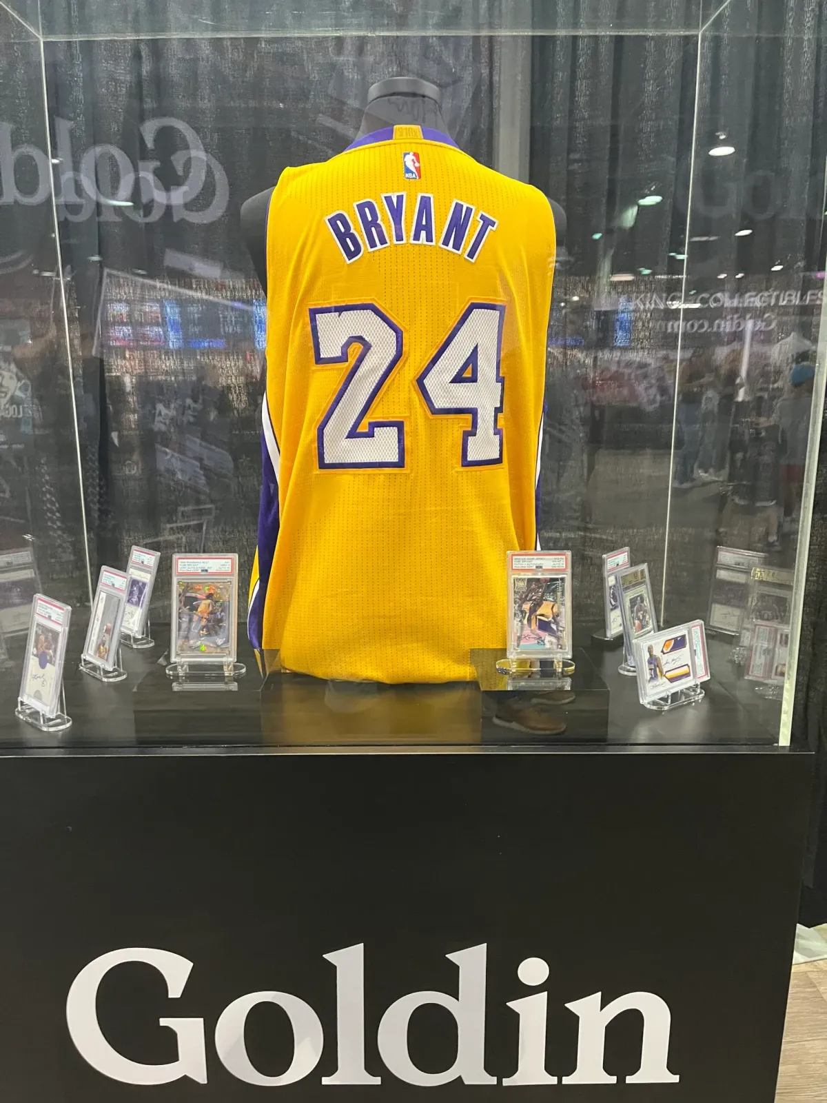 Kobe Bryant jersey and cards on display at the Goldin booth at The National.