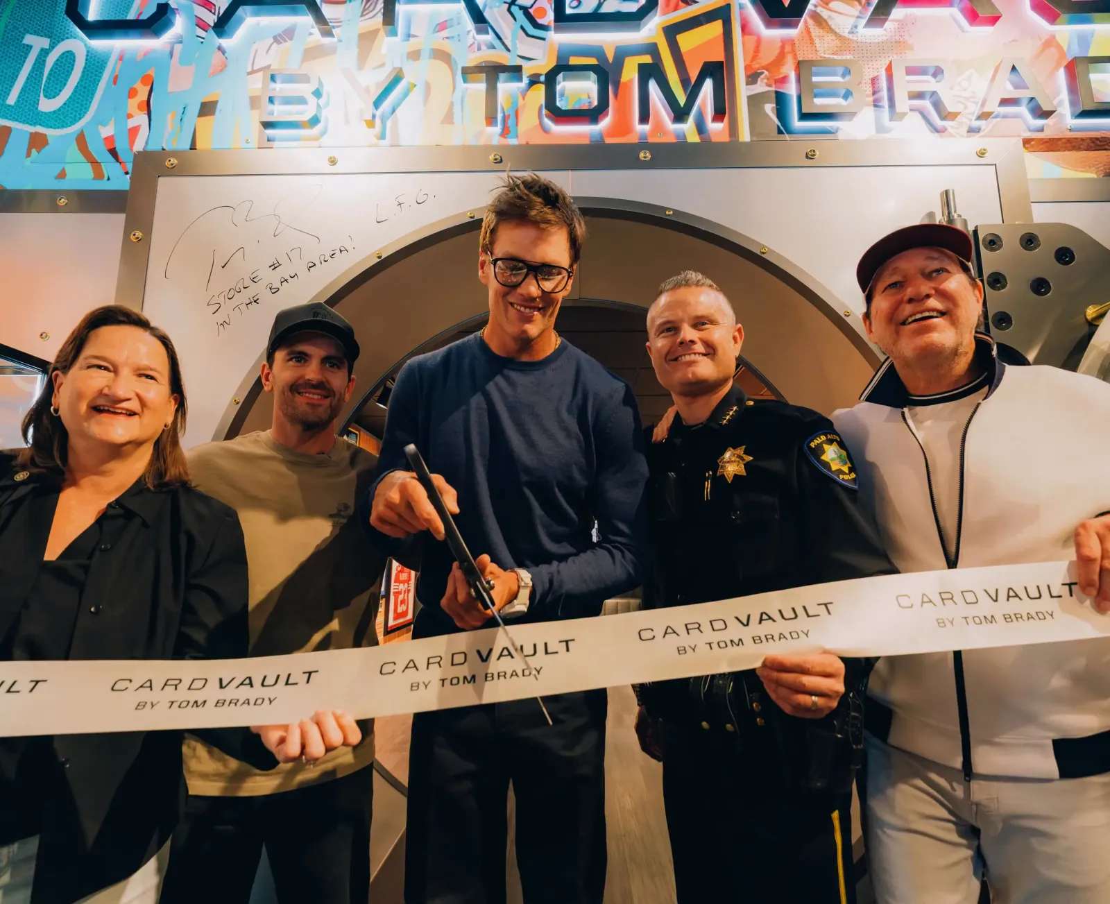 Cutting the ribbon on the latest Card Vault by Tom Brady store in Palo Alto.