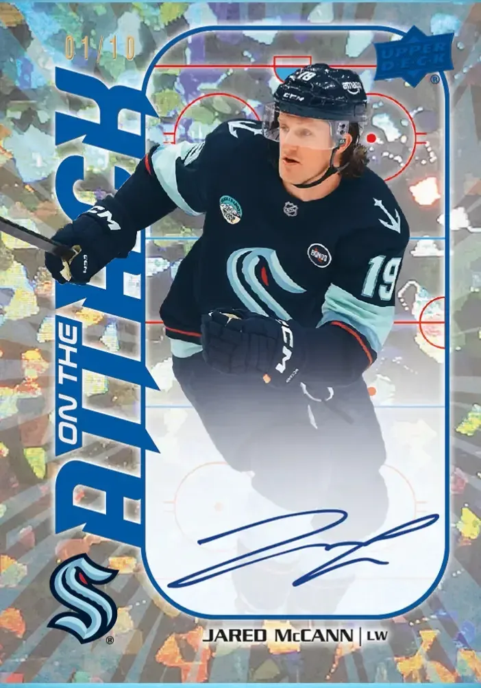 Image of Jared McCann card a blue parallel wearing dark blue jersey over cracked shimmering fractal pattern.