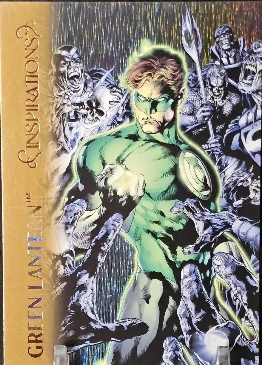 Illuminated green lantern in colorful green suit surrounded by black and white zombie like attackers grabbing at the hero.