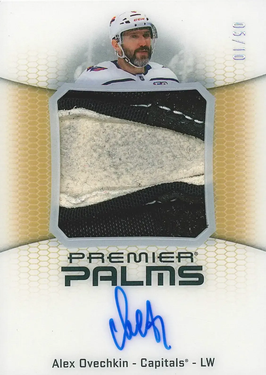 Image of card with picture of player on top of glove fabric with blue signature below.