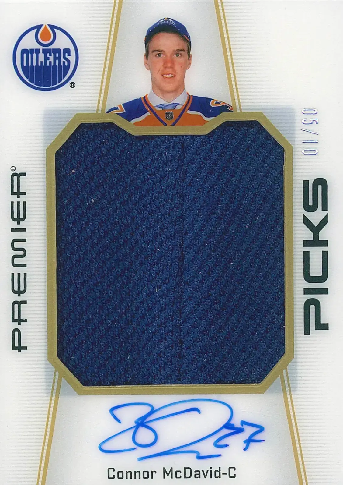 Image of player above patch with blue signature at bottom of card