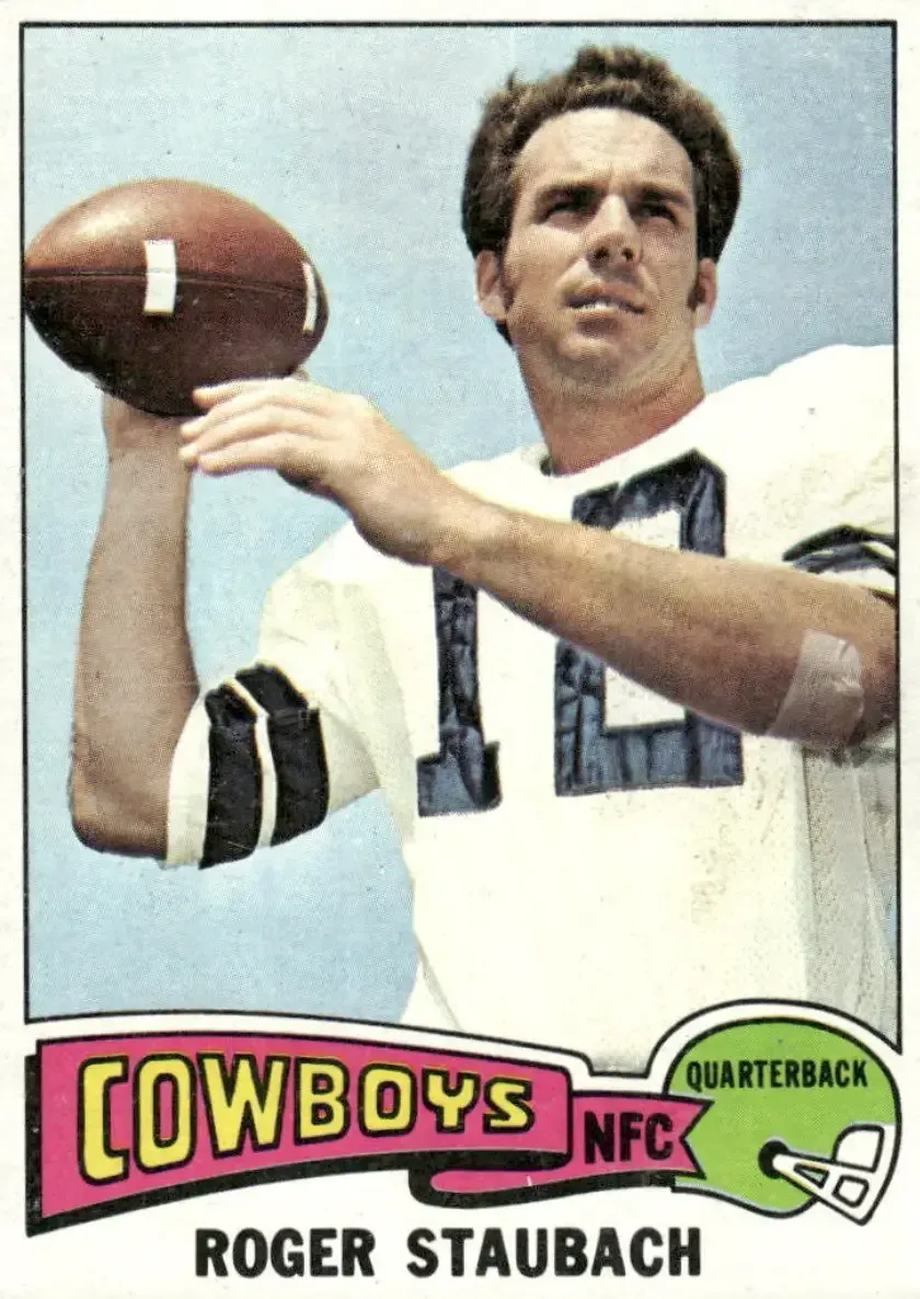 Image of Staubach on '75 card with football in right hand, wearing #12 on white jersey, bandage on left elbow.