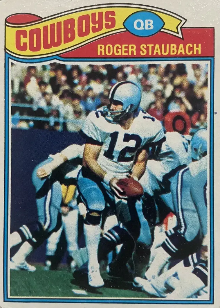 Image of player in action with football in hand seemingly looking for a hand off on the right side of the offense.