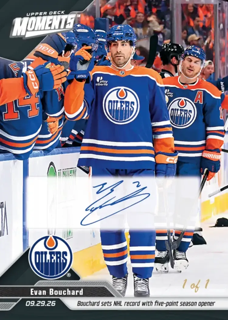 Image of player having moment with teammates on the bench, card features 1 of 1 in gold, and black treatment.