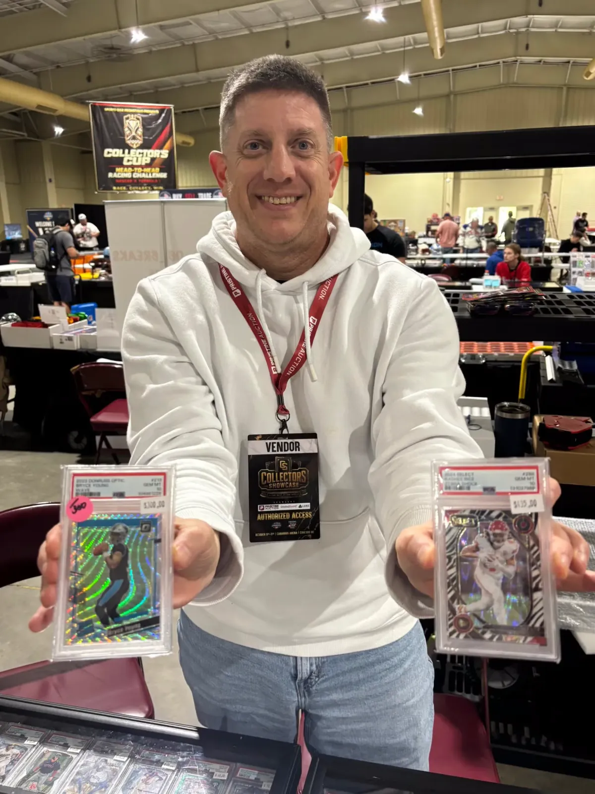 Dealer Curtis Van Duren shows off some of his football cards.