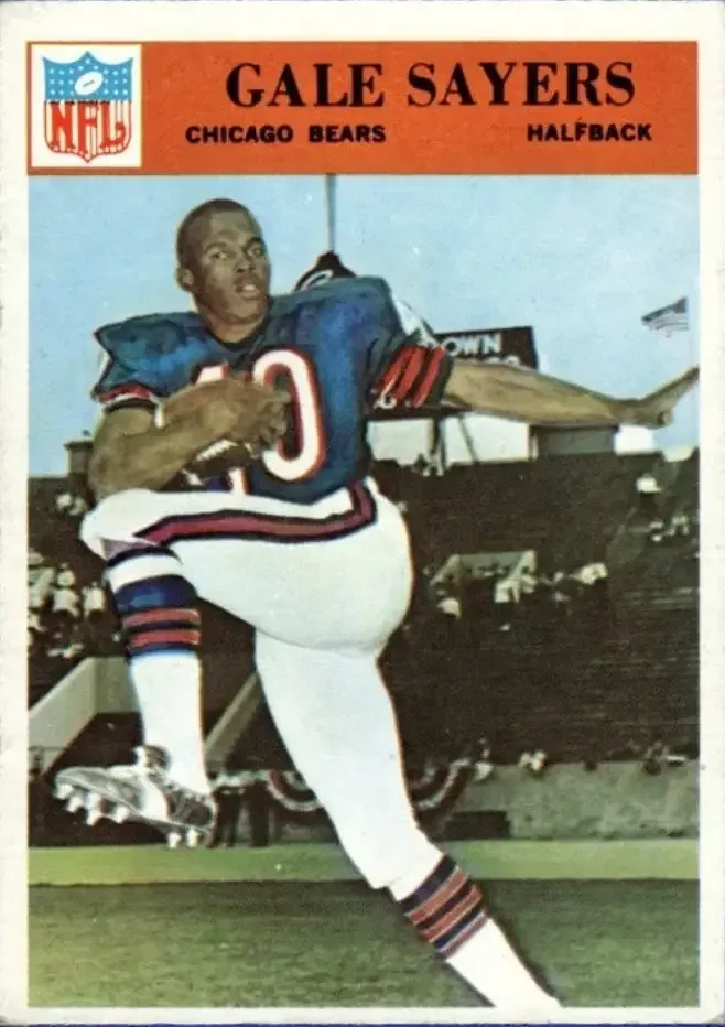 Image of Sayers in running position with left arm stretched out.